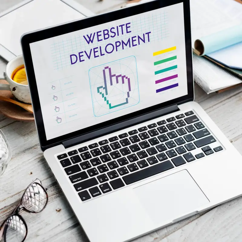Custom web design for a Saginaw MI small business displayed on laptop and phone